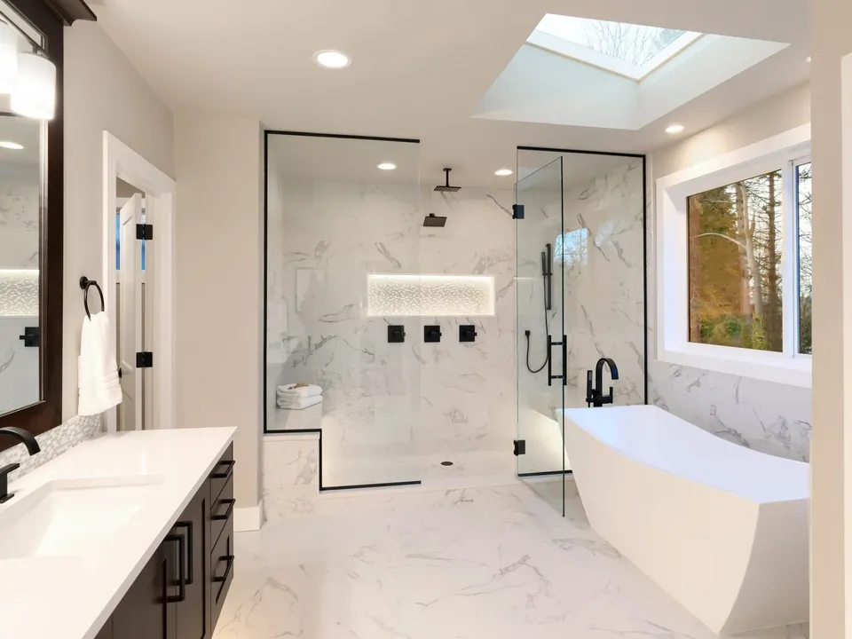 Remodelled bathroom with a new tub and shower by Vista Home Improvement